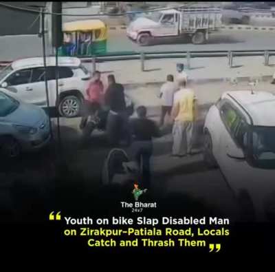 Guys on bike slap disabled man in Patiala, India.