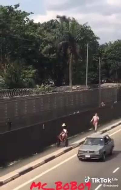 Crazy guy, who has been escaping of mental institution follows people with knife