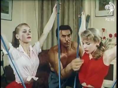 Peculiar excersise apparatus called, "Picas" to workout, women try it in 1956.