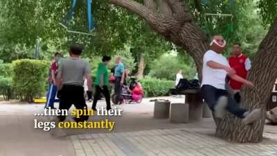 Elderly people in China doing "neck workouts"