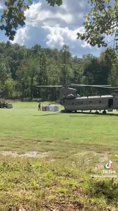 US Army air dropping supplies to folks still trapped at Lake Lure, North Carolina