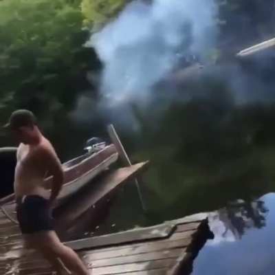 Guy launches a firework from his ?