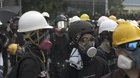 Protestors Checking their Helmets