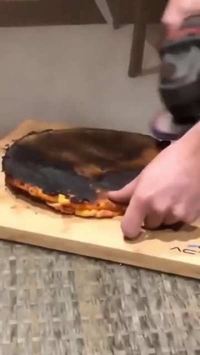 removing the burnt part of a pizza