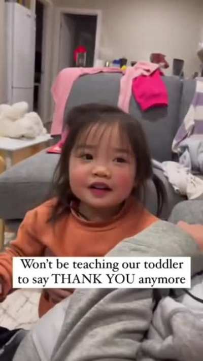 Teaching their little Asian daughter to say "Thank You"