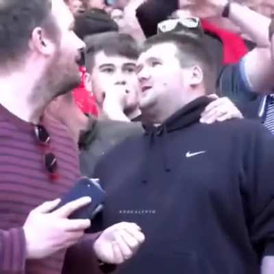 A guy explaining the match to his blind friend