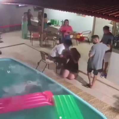 Wearing heels by a swimming pool