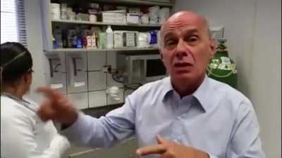 A very serious man getting vaccine
