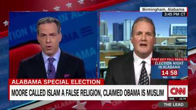 Jake Tapper fact checks Ted Crockett, a spokesman for Judge Roy Moore's campaign, about lawmakers having to swear on the Bible, and leaves Ted speechless.