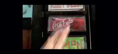 Boy using the vending machine