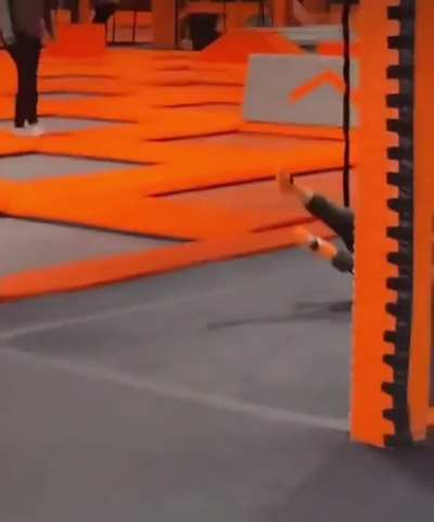 Excited kid confused by “invisible wall” at trampoline centre.