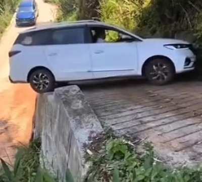 No way the car wouldn't fall;but whoever is driving F*CKING hats off to them??
