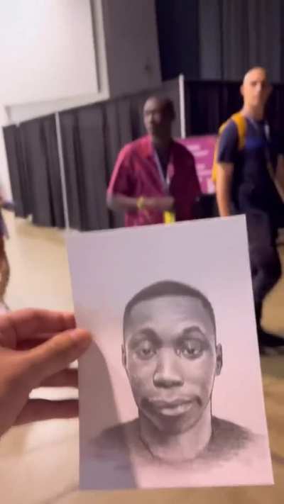 Devon Rodriguez, an artist from the Bronx, giving celebs portraits he drew of them