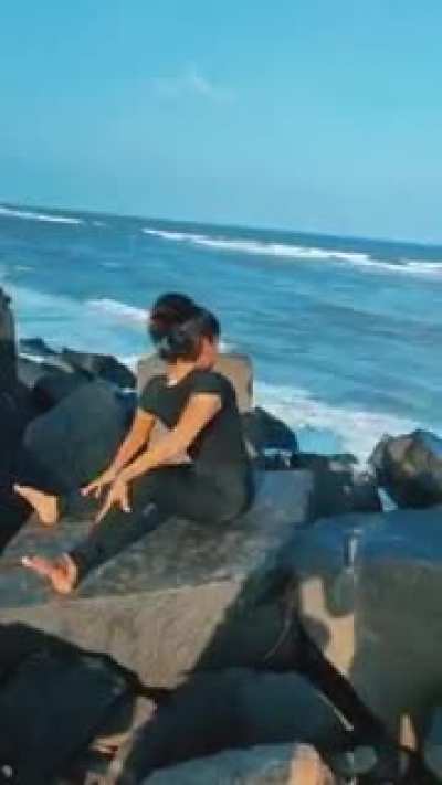 Yoga expert girl turns her upper body 180°
