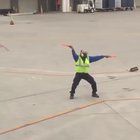 Airport worker making the best out of his day
