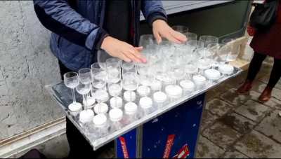 Street performance with wine glasses