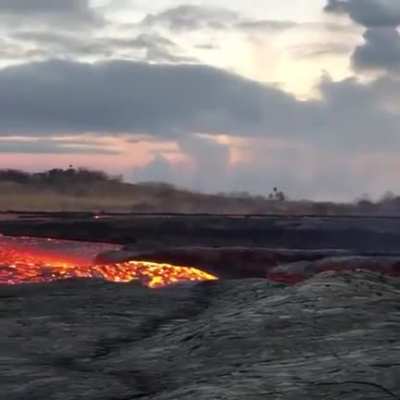 Close up footage of a fast flowing river of lava rushing from Hawaii’s Kilauea volcano captured by John Tarson from Epic Lava Tours.