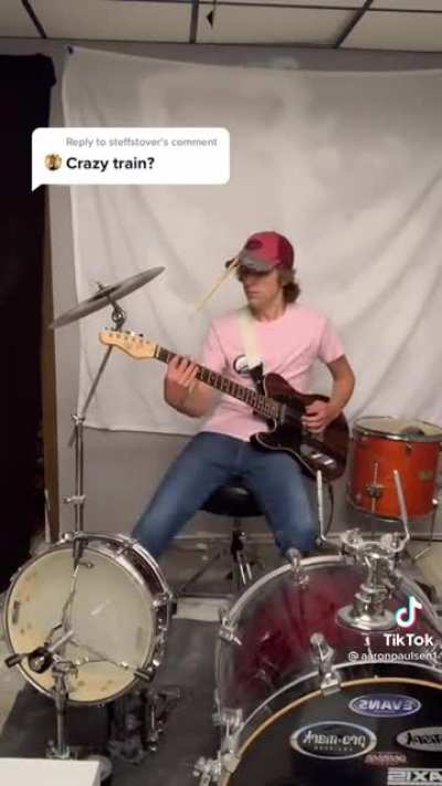 This guy plays Crazy Train on guitar and drums at the same time!