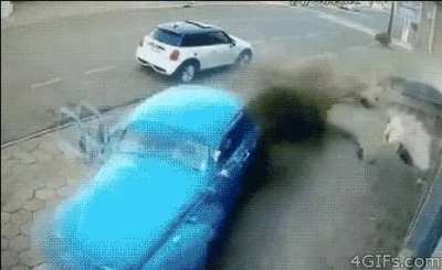 Volkswagen bug loses control and almost hits a man.