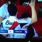 Just a soccer fan sniffing some substance.