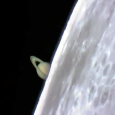 Saturn rising from behind the Moon during a lunar occultation, captured from a ground based telescope by astronomer Jan Koet