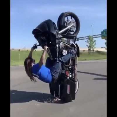 That’s a big bike to get up one wheel. Big idiot to do it on a public road with no helmet, too.