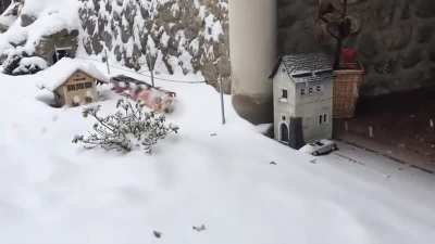 Model train with rotary snow plow.