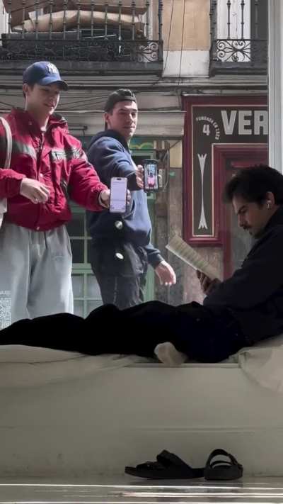 A guy in Spain has been living inside of a window for 10 days now as part of an art project