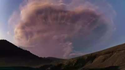 ? Volcano erupting whilst lightning strikes