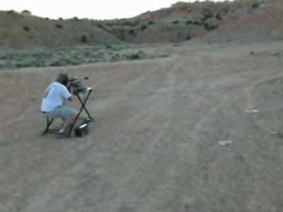 .50 Cal Shot at 1000 yards Riochets back, hits the guys ear muffs knocking them off, doesn't injure shooter.