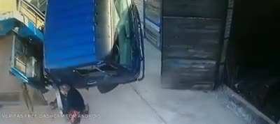 Did he really expect to hold up an overloaded truck all by his lonesome?