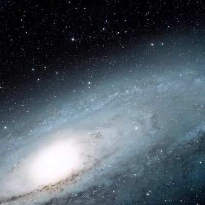 Zoom in on the Andromeda Galaxy with Hubble. What looks like a smudge of light to the unaided eye is actually a vast galaxy containing an estimated 1 trillion stars.