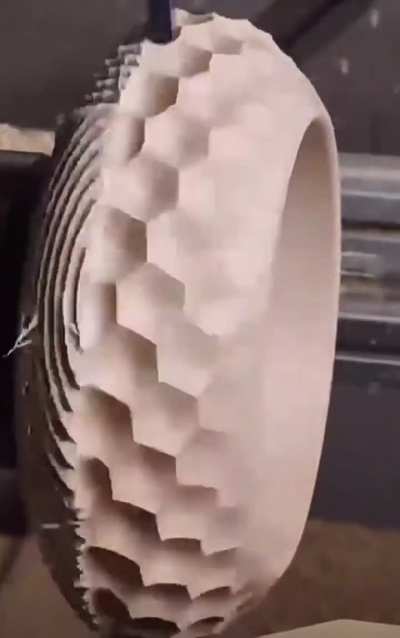 Carving a geometric patterned bowl out of a block of wood.