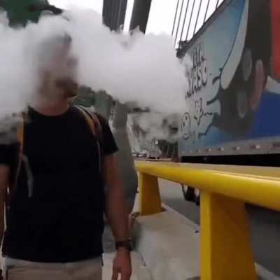 Smoking beside a moving truck