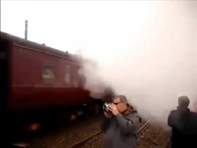 Oblivious trainspotter narrowly avoids a rather nasty "ouchie"