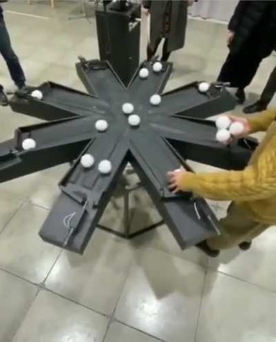 Art student Shun Onozawa devised "Movement Act," a mesmerizing device that employs a golden formula to keep 16 balls in continuous motion without collisions