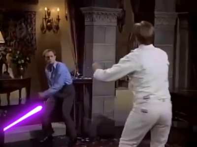 Niles Crane (David Hyde Pierce) duels a German swordsman in a scene from "Frasier", but with the added effect of Lightsabers