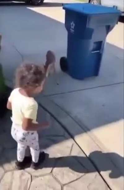 ? A young girl's encounter with a curious fawn ?