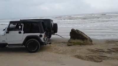 Trying to pull rock with two Jeep