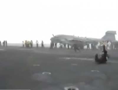 Standing behind a jet engine.