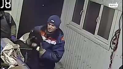 Guy sorting garbage saves a cat that was sealed in a bag and thrown away