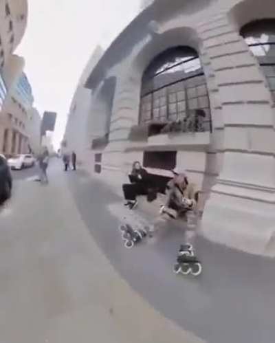WCGW skating between a parked car and the side walk
