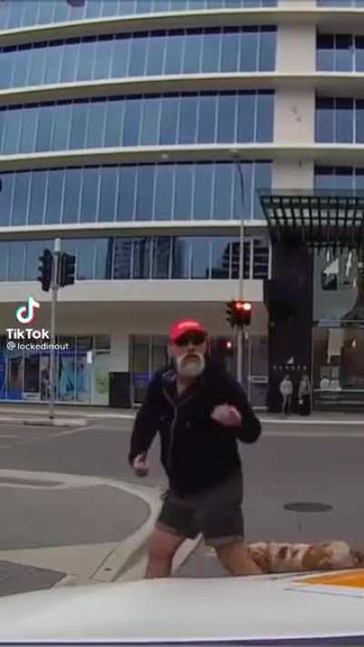 Man angry at guy in car for stopping