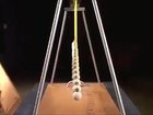15 uncoupled pendulums of increasing lengths dance and produce visual traveling waves, standing waves and beating