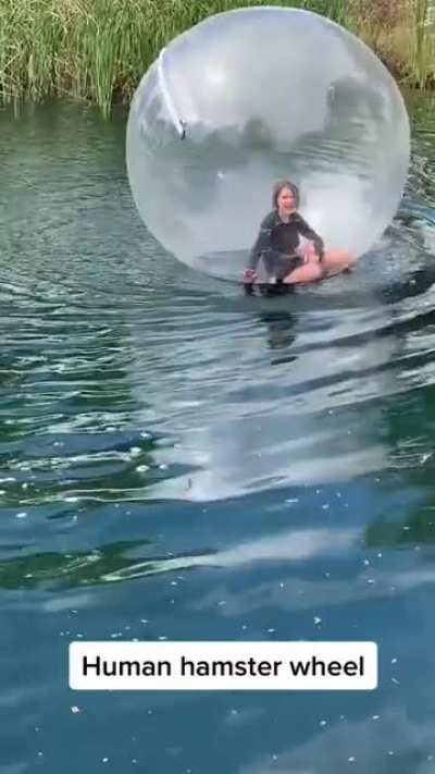 Girl Jumps Into A Lake To Walk On Water Inside A Plastic Bubble