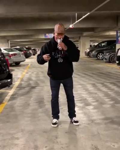 Attempting to do some sort of stunt involving a beer can...