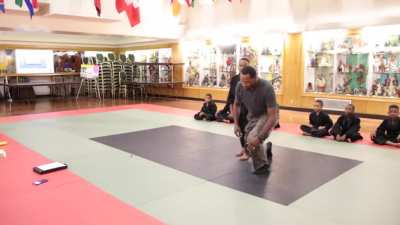 Martial arts instructor teaches young student mental fortitude &amp; how to break through emotional barriers during training