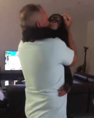 Rescued baby chimp is super excited when he gets to see his old caretaker .