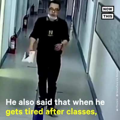 Tired teacher puts on "happy face" before entering his room to teach.