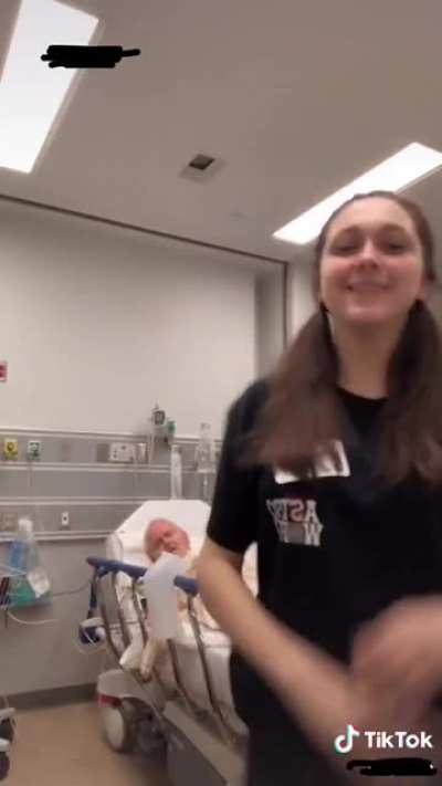 Girl does Tik Tok next to DYING GRANDFATHER